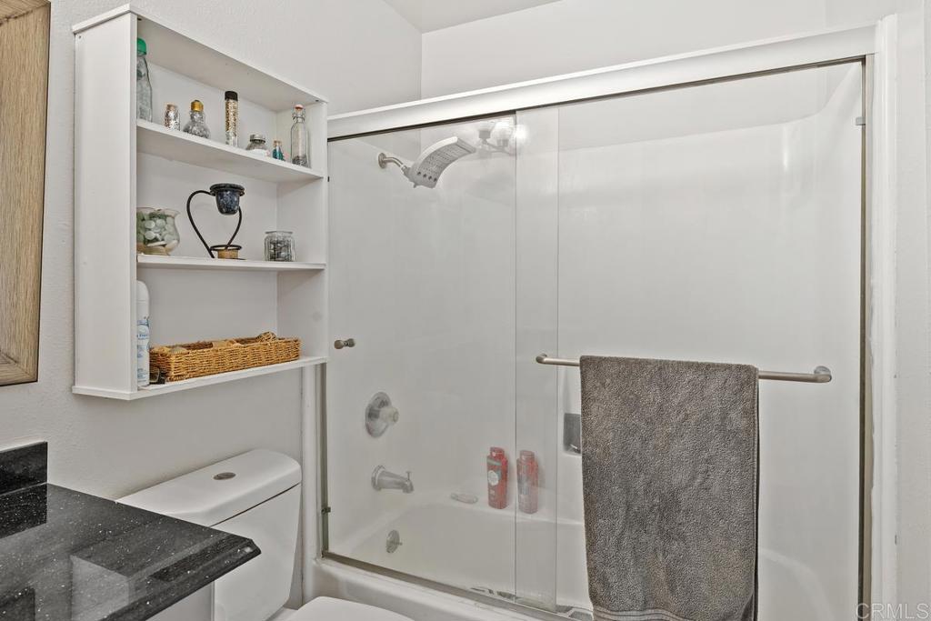 12553 Mapleview Street, Unit 28 Lakeside, CA 92040 - Photo 17 of 26 a bathroom with a bathtub and a shower