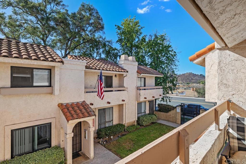 12553 Mapleview Street, Unit 28 Lakeside, CA 92040 - Photo 19 of 26 a balcony with table and chairs