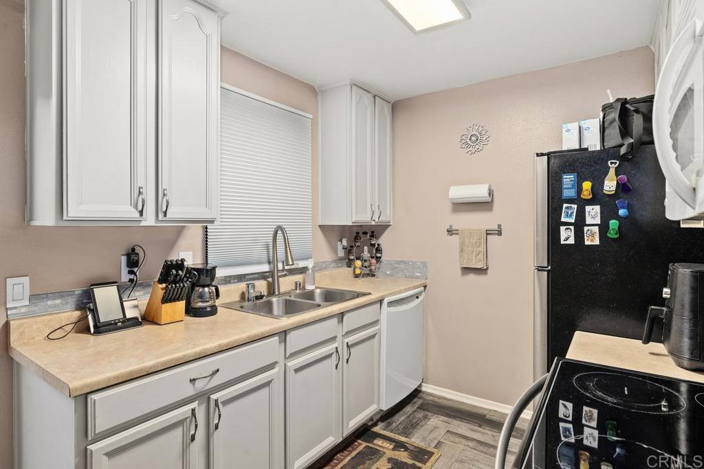 12553 Mapleview Street, Unit 28 Lakeside, CA 92040 - Photo 9 of 26 a kitchen with a sink and cabinets