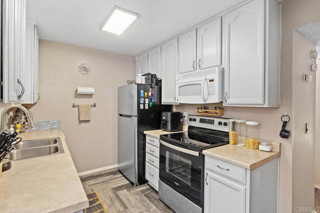 12553 Mapleview Street, Unit 28 Lakeside, CA 92040 - Photo 10 of 26 a view of a kitchen with sink stove and refrigerator