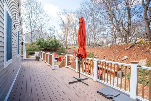 a view of a wooden deck with trees