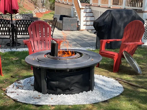 a view of outdoor space with seating and barbeque oven