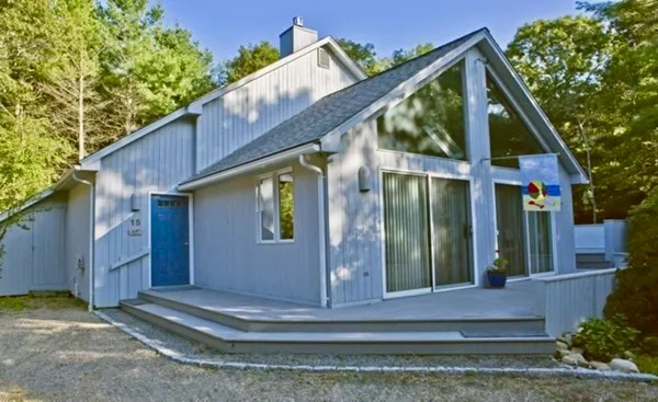 a view of a house with a yard and plants
