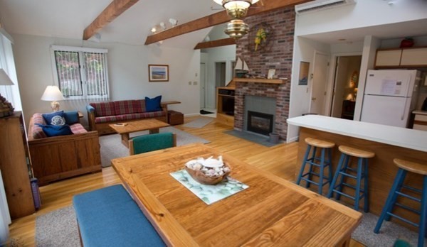 15 Prices Way Edgartown, MA 02539 - Photo 2 of 10 a living room with furniture and a fireplace
