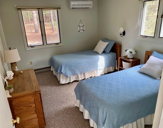15 Prices Way Edgartown, MA 02539 - Photo 5 of 10 a bedroom with two beds and painting on the wall