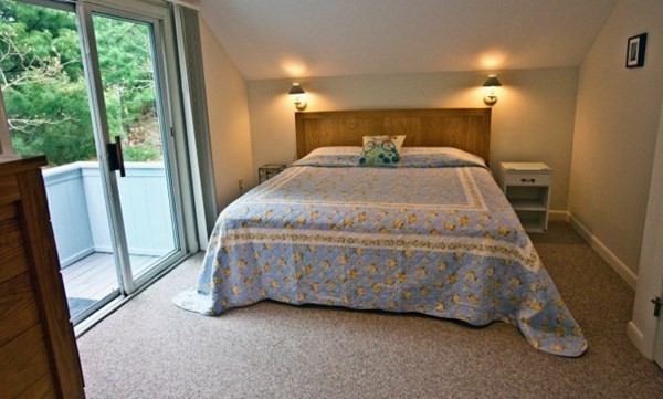 15 Prices Way Edgartown, MA 02539 - Photo 6 of 10 a bed sitting in a room next to a window