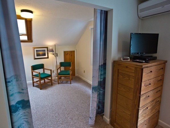 15 Prices Way Edgartown, MA 02539 - Photo 7 of 10 a living room with furniture and a flat screen tv