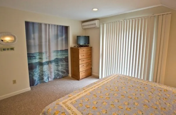 a view of a livingroom with furniture and staircase