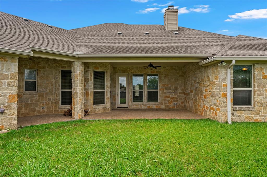 144 Ellis Farm Road Hewitt, TX 76643 - Photo 32 of 36 Expansive backyard featuring a manicured lawn