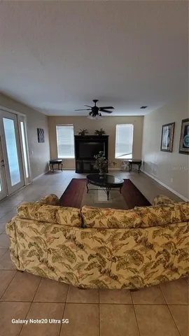 a living room with a couch and fireplace