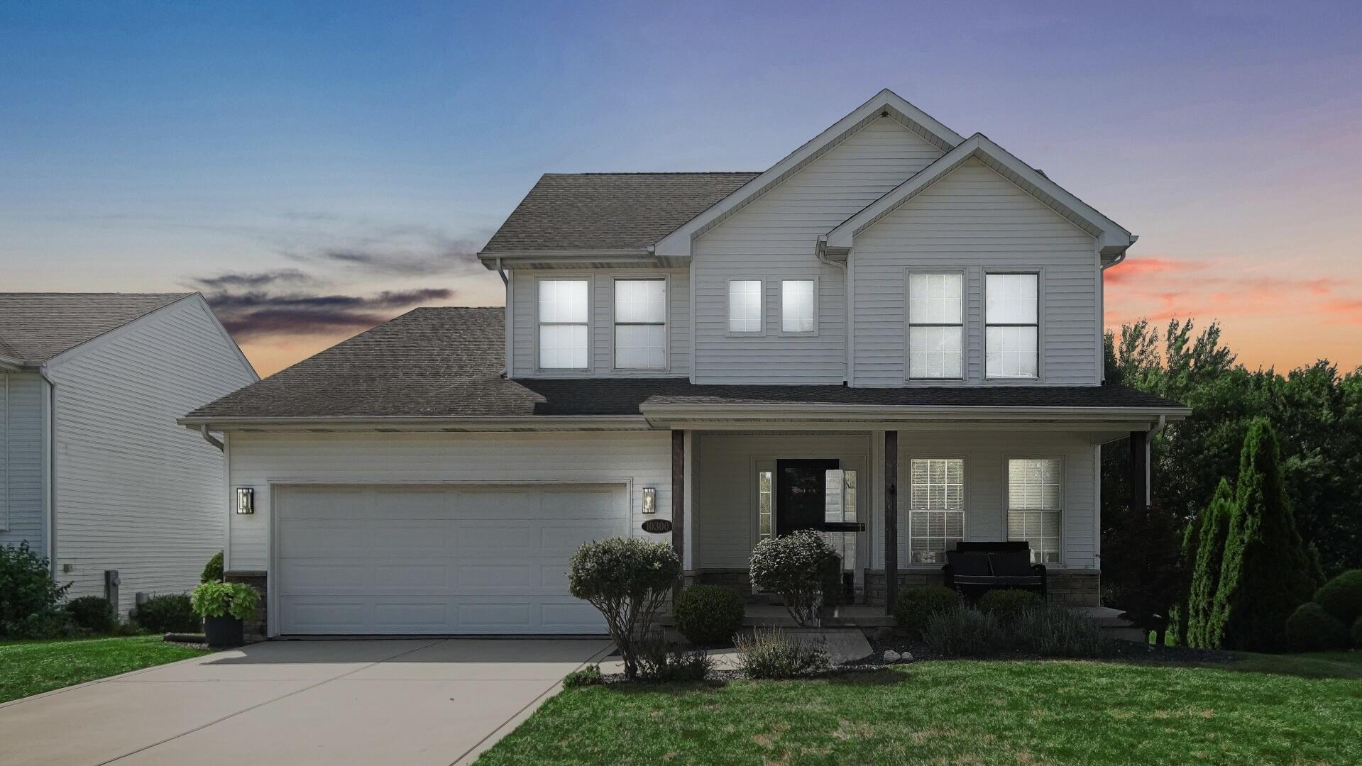 10300 Illinois Street Crown Point, IN 46307 - Photo 1 of 29 a front view of a house with garden