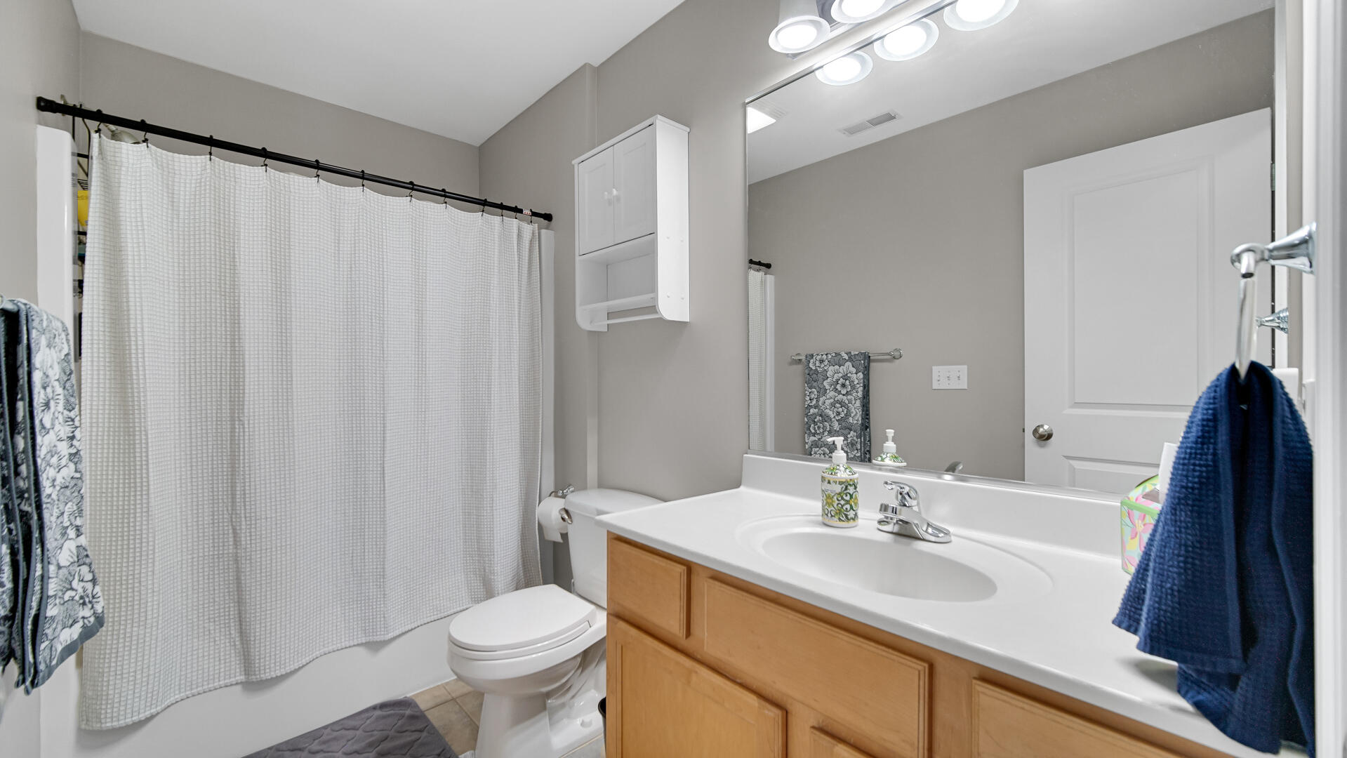 10300 Illinois Street Crown Point, IN 46307 - Photo 15 of 29 a bathroom with a sink toilet and shower