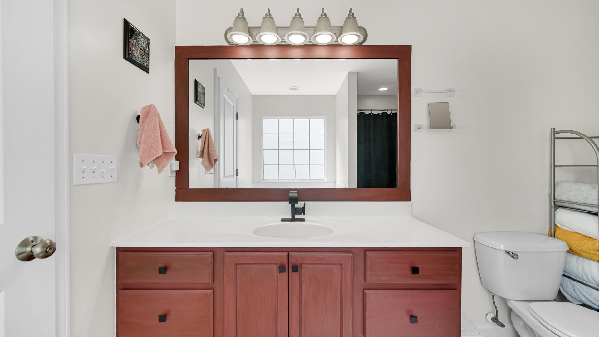 10300 Illinois Street Crown Point, IN 46307 - Photo 17 of 29 a bathroom with a sink and a mirror