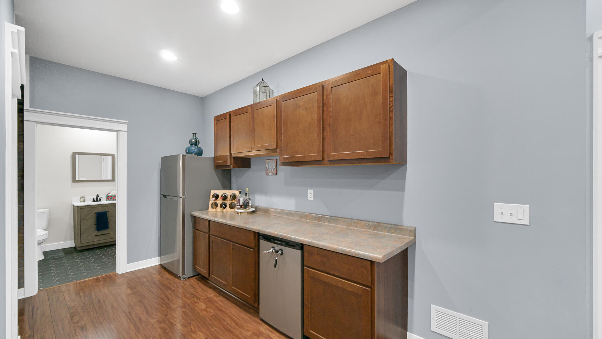 10300 Illinois Street Crown Point, IN 46307 - Photo 21 of 29 a kitchen with a stove a refrigerator and a sink