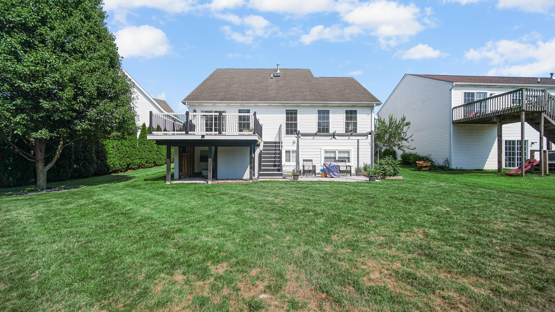 10300 Illinois Street Crown Point, IN 46307 - Photo 26 of 29 a aerial view of a house next to a yard with big trees