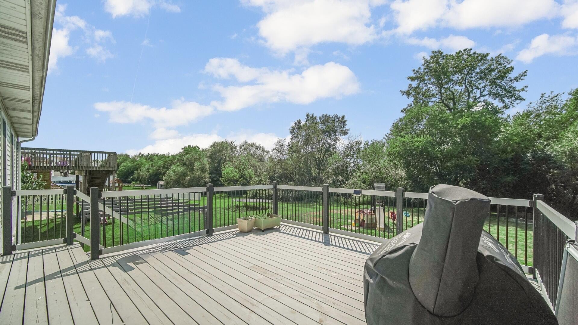 10300 Illinois Street Crown Point, IN 46307 - Photo 27 of 29 a view of balcony with deck and wooden floor