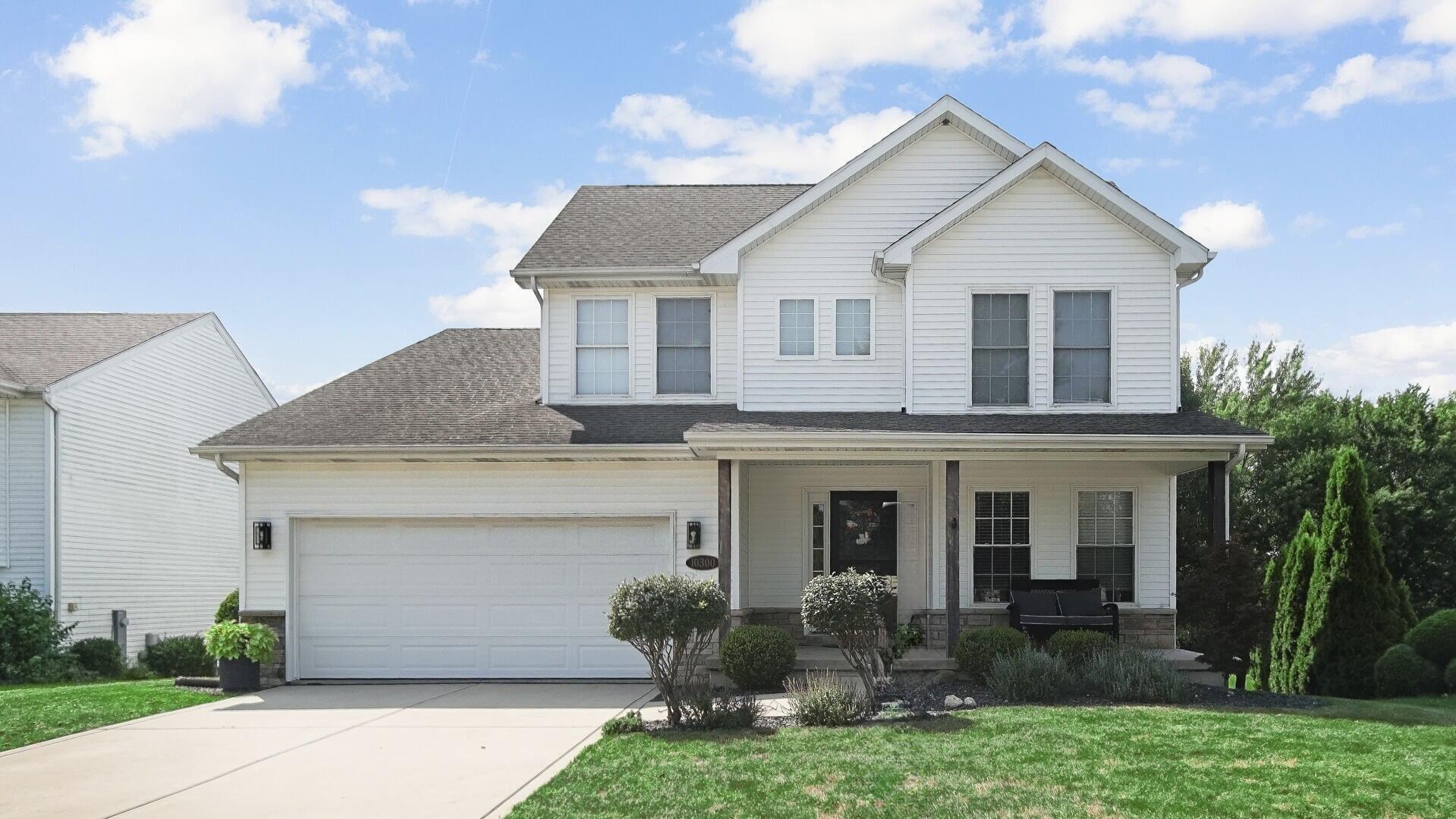 10300 Illinois Street Crown Point, IN 46307 - Photo 29 of 29 a front view of a house with garden