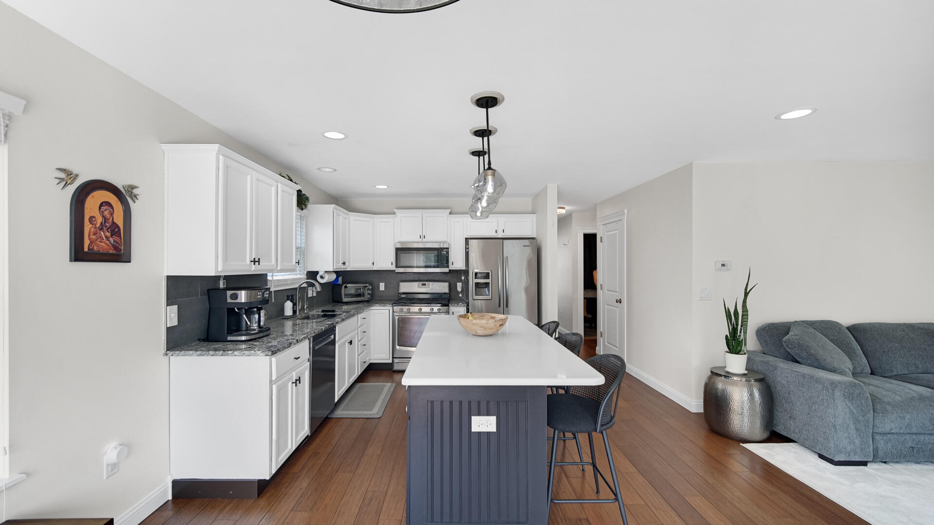 10300 Illinois Street Crown Point, IN 46307 - Photo 5 of 29 a open kitchen with stainless steel appliances granite countertop a stove and a refrigerator