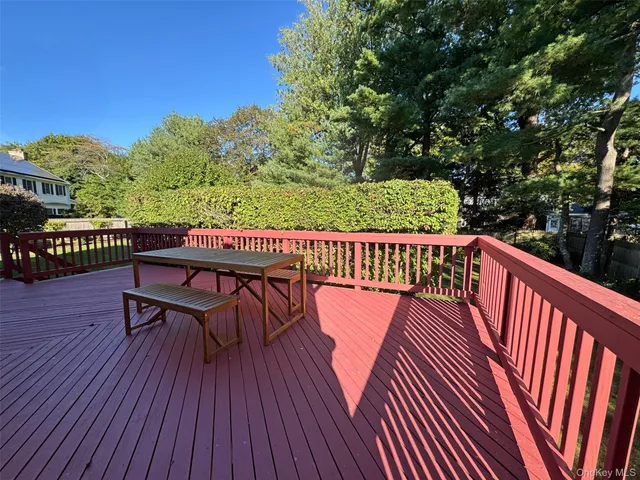 a view of balcony with furniture and wooden floor