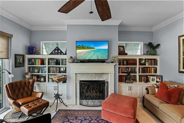a living room with furniture a rug and a fireplace