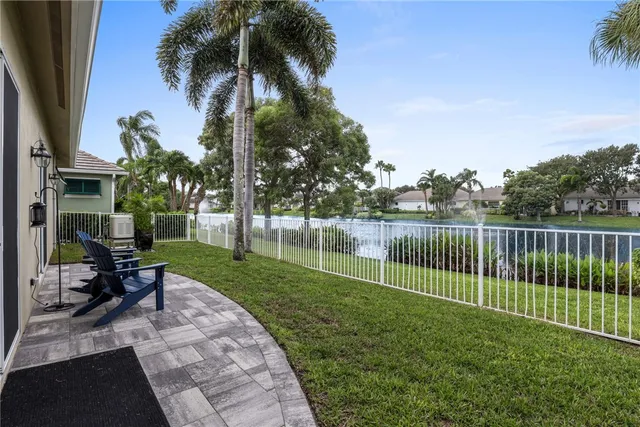a view of a chair and table in the garden