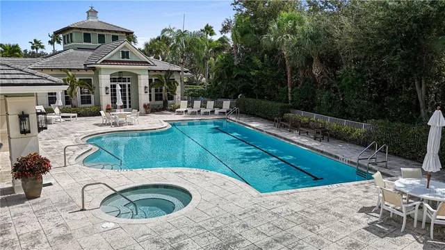 a view of a patio with couches chairs and a fire pit