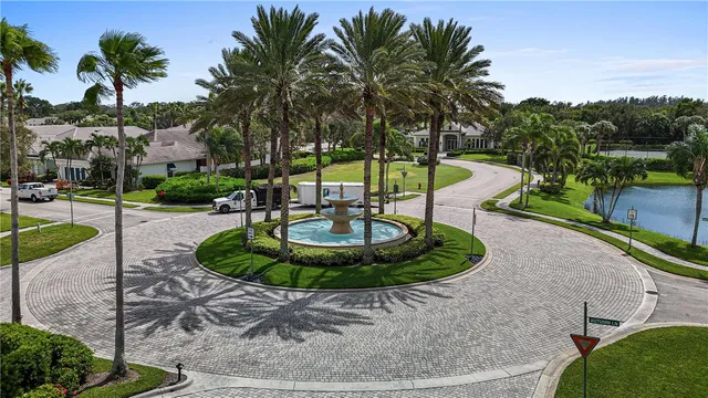 a swimming pool with outdoor seating and yard
