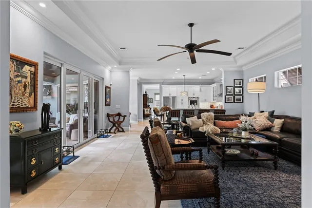 a living room with lots of furniture and wooden floor