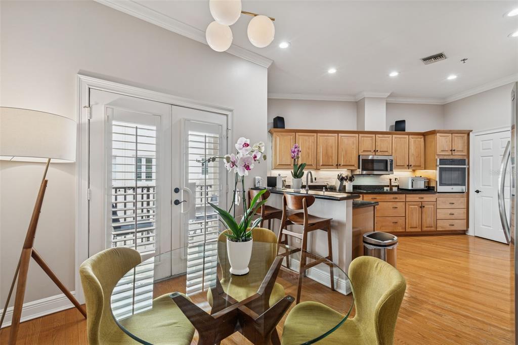 1001 South Rome Avenue, Unit 9 Tampa, FL 33606 - Photo 11 of 25 a view of a dining room with furniture window and wooden floor