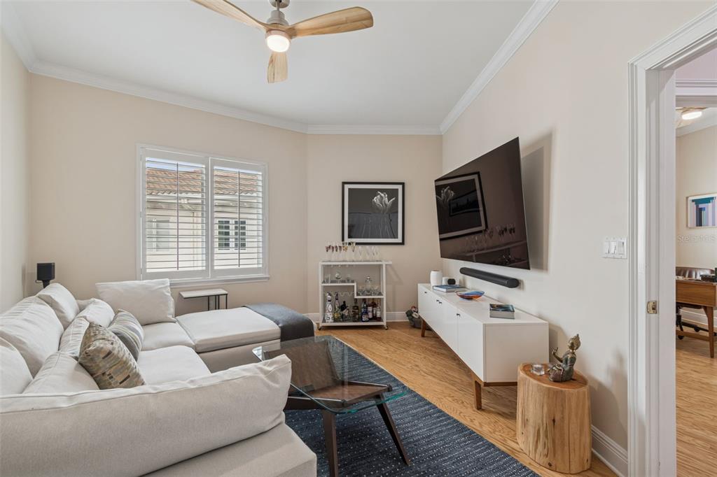 1001 South Rome Avenue, Unit 9 Tampa, FL 33606 - Photo 17 of 25 a living room with furniture and a flat screen tv