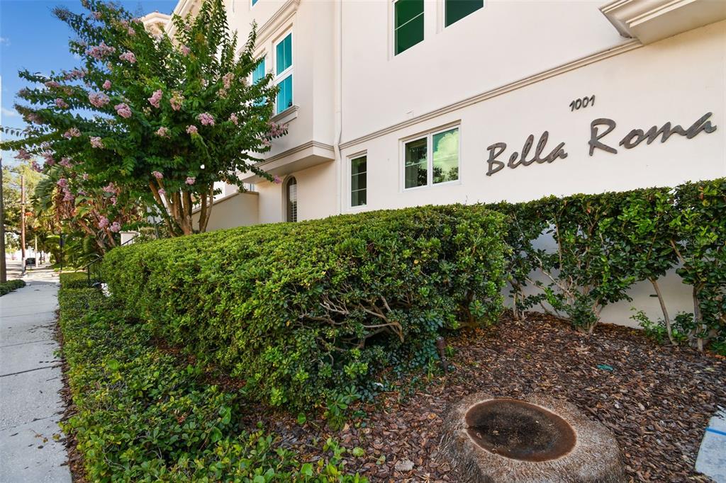 1001 South Rome Avenue, Unit 9 Tampa, FL 33606 - Photo 2 of 25 a street view with wooden fence and plants