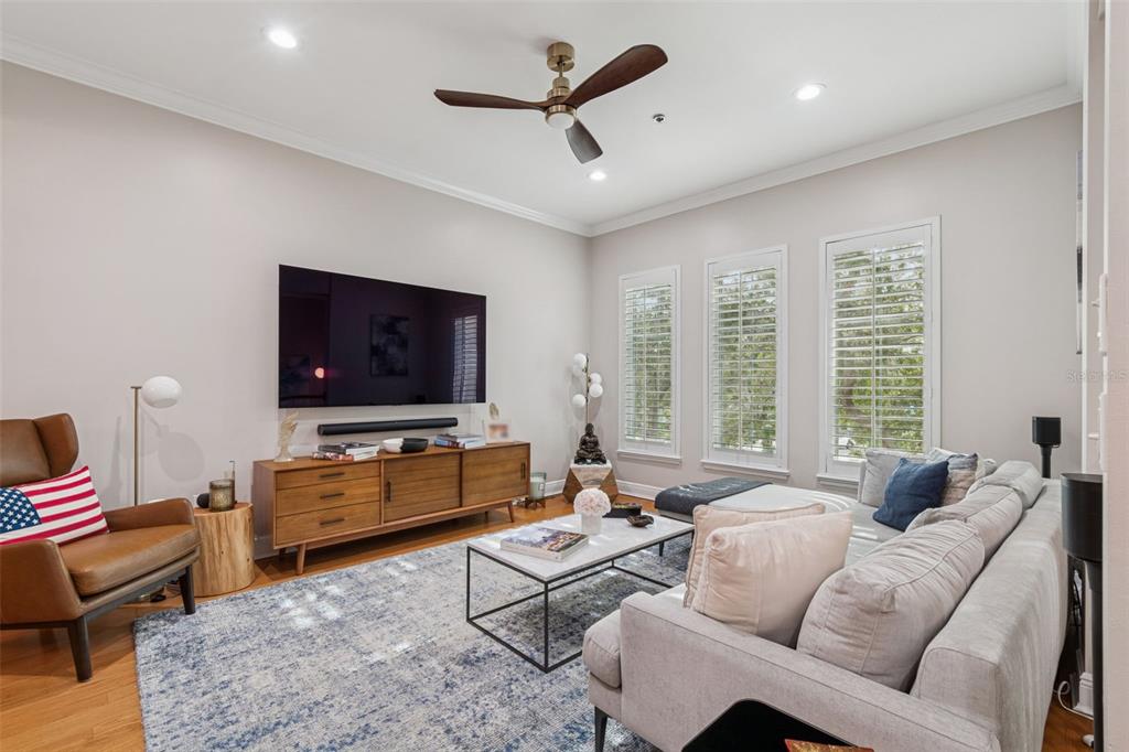 1001 South Rome Avenue, Unit 9 Tampa, FL 33606 - Photo 6 of 25 a living room with furniture and a flat screen tv
