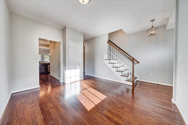 a view of an entryway with wooden floor