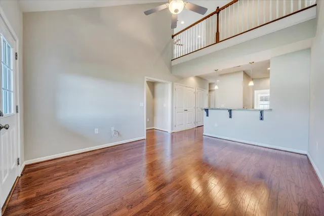 a view of a hallway with wooden floor