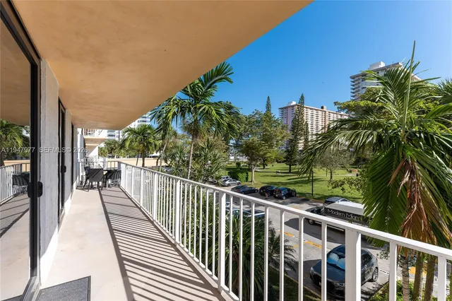 an aerial view of a house with a swimming pool patio and outdoor seating