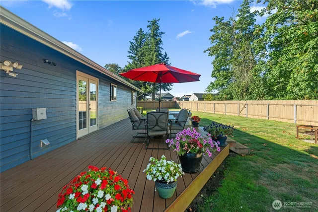 a view of a backyard with sitting area