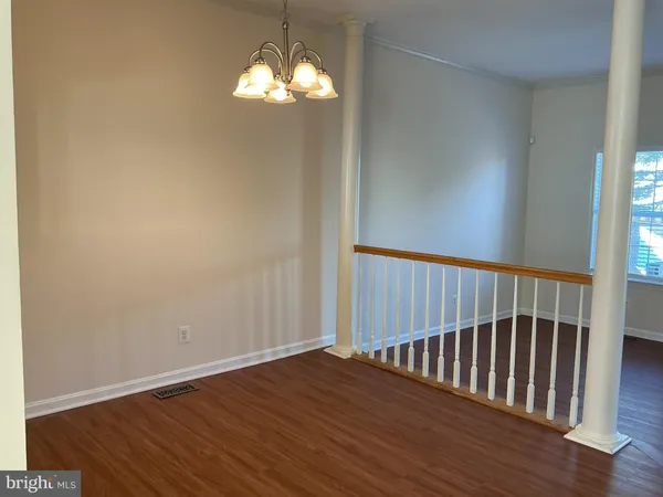 a view of a balcony with wooden floor