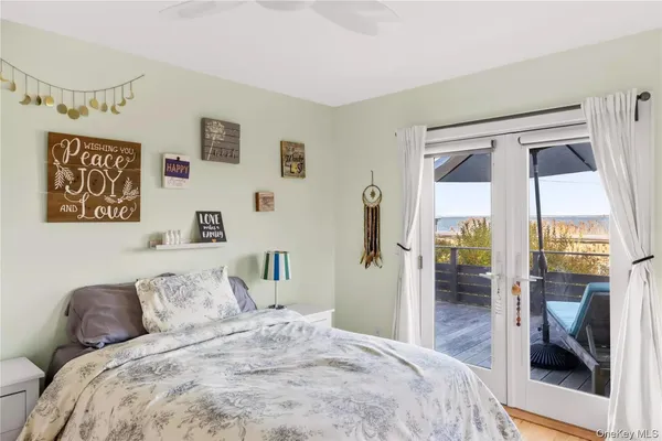 a bedroom with a large bed and a large window