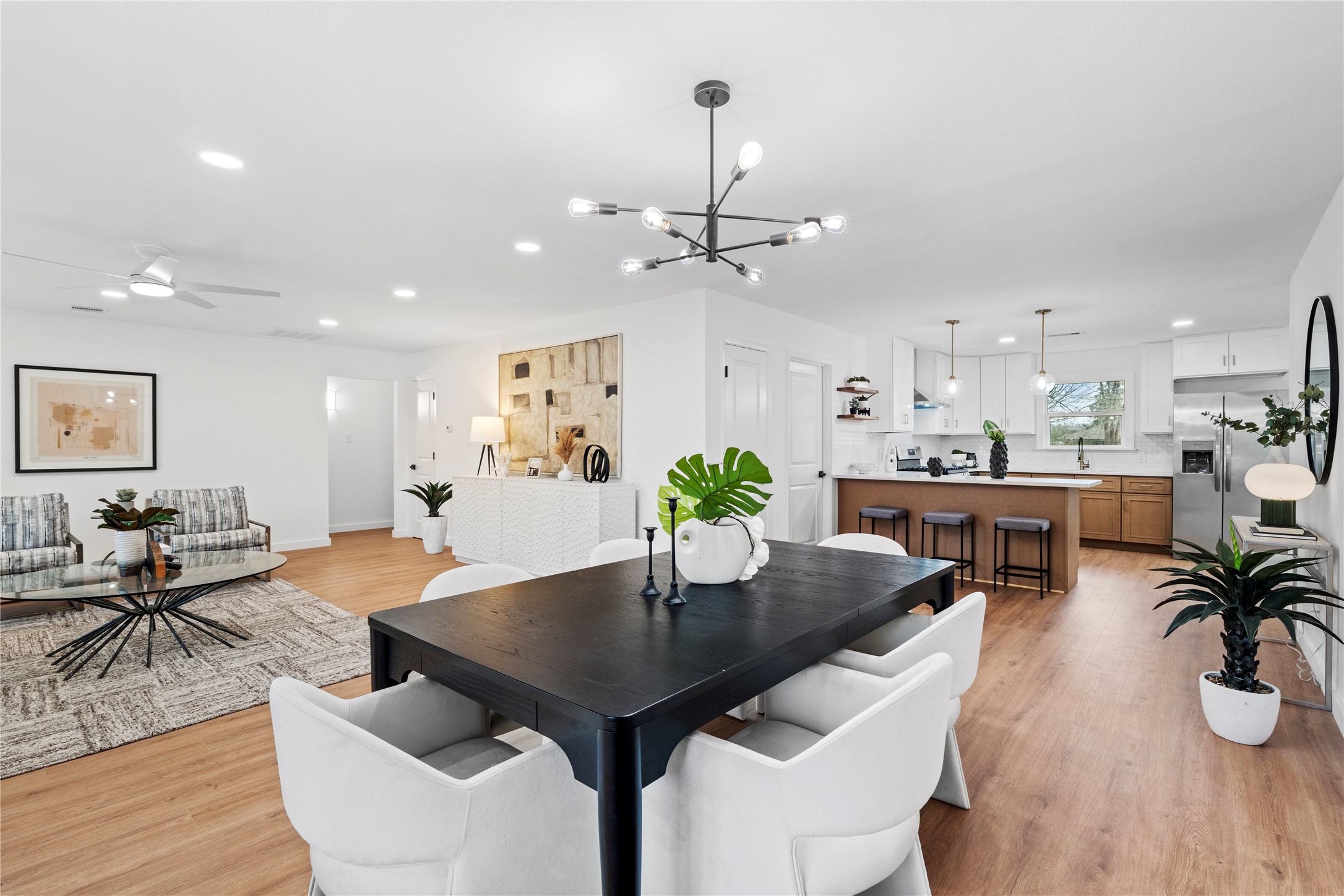 5023 Redstart Street Houston, TX 77035 - Photo 11 of 34 The dedicated dining area is perfectly positioned between the living room and kitchen, creating an inviting flow for dinner parties and holiday gatherings.