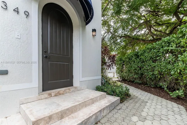 a front view of a house with garden