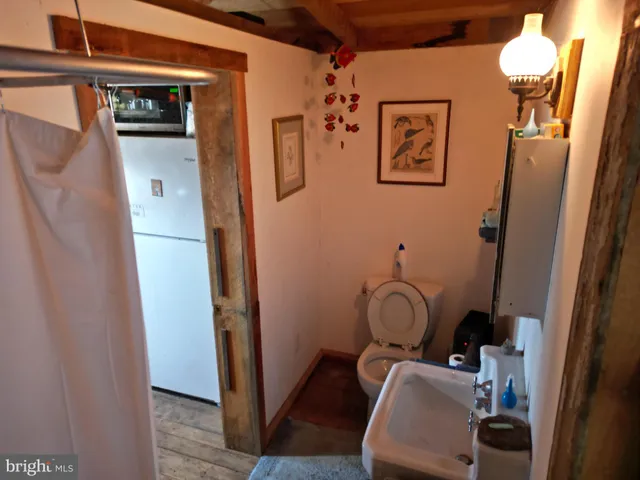 a view of a house with large windows and a yard