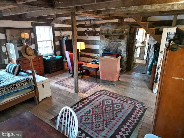 a bedroom with furniture and a window