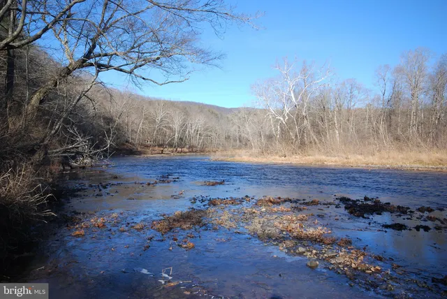 a backyard of a house with outdoor seating