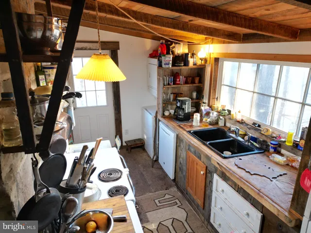 a bedroom with bed and window