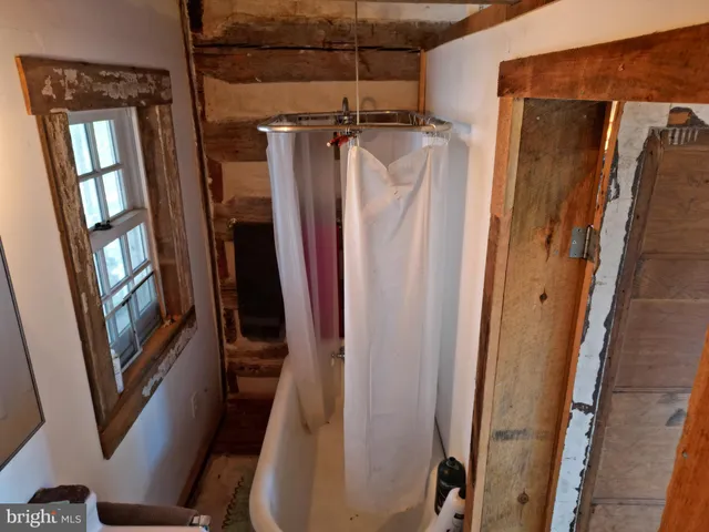a view of balcony with wooden floor and furniture