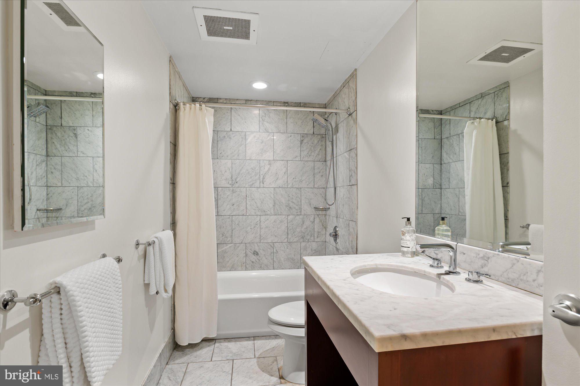 912 F Street Northwest, Unit T01 Washington, DC 20004 - Photo 13 of 32 Marble bathroom