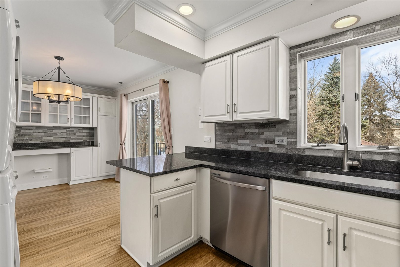 7610 West 26th Street, Unit 6 North Riverside, IL 60546 - Photo 10 of 21 a kitchen with granite countertop a sink and cabinets