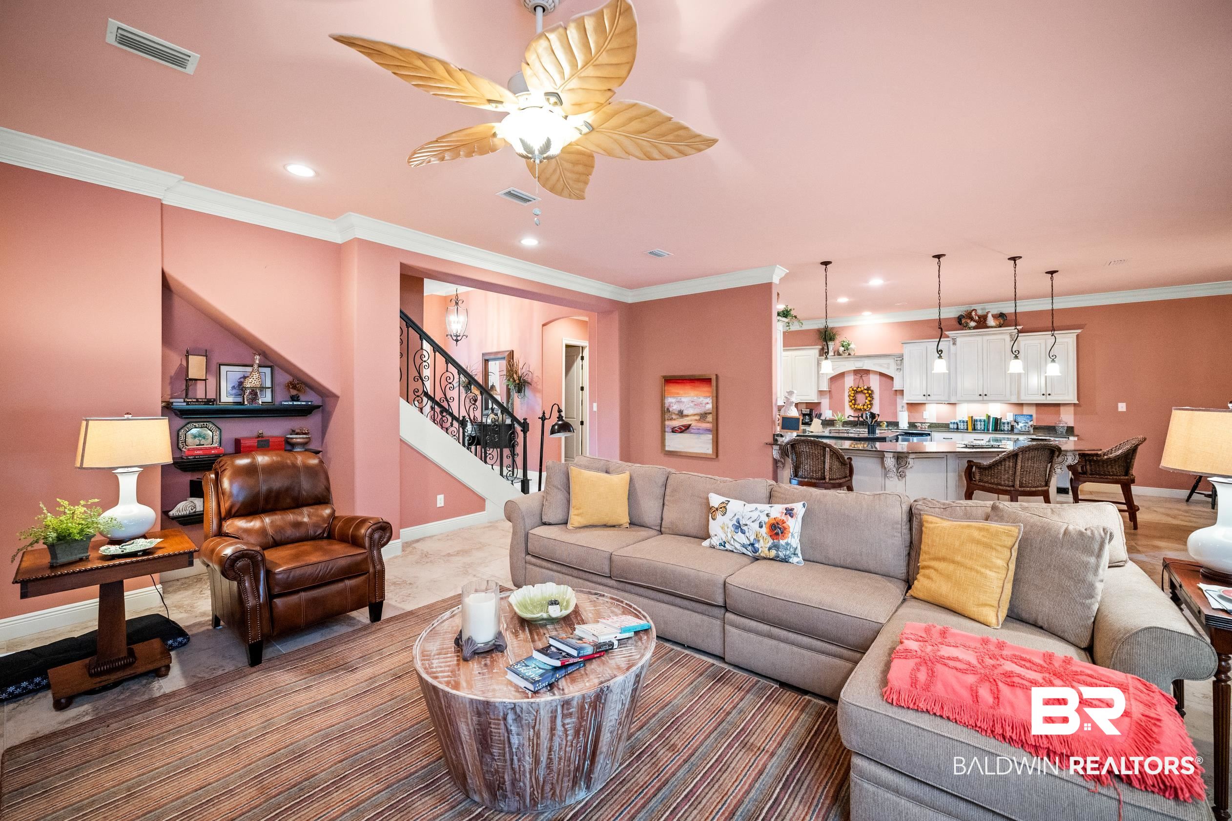 404 Peninsula Boulevard Gulf Shores, AL 36542 - Photo 2 of 51 Living room featuring ornamental molding, a ceiling fan, stairs, and recessed lighting