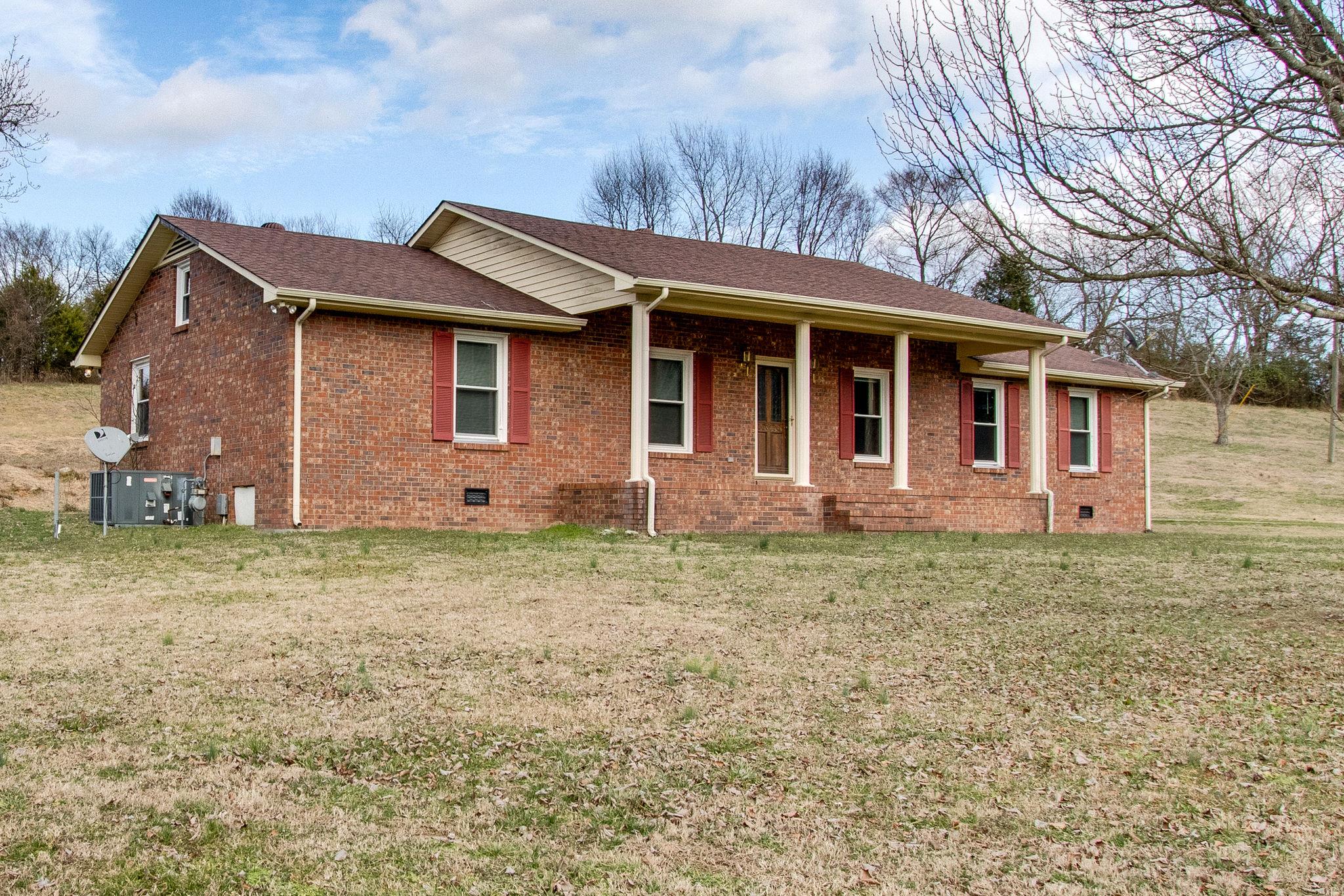 961 New Hope Road Alexandria, TN 37012 - Photo 2 of 24 Large rocking chair front porch!