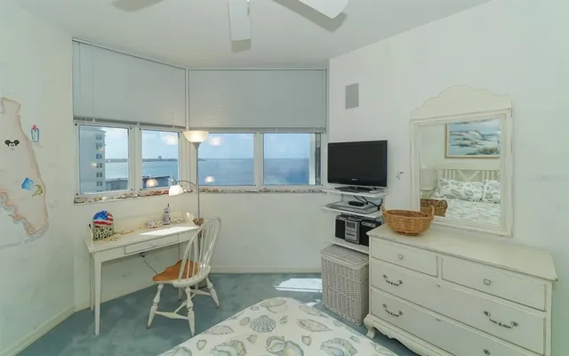a view of a chairs and table in a patio